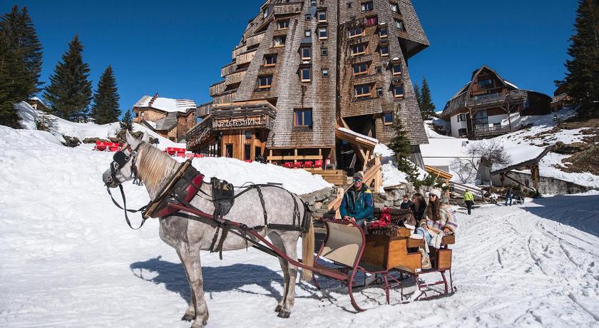 a horse pulling a carriage down a snow covered slope, Hotel des Dromonts by SOWELL COLLECTION in Morzine