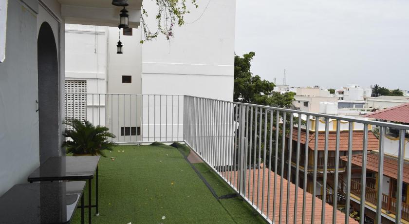a patio area with a fence and a building, Le Chateau - A Heritage Boutique Hotel in Pondicherry