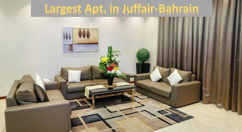 a living room filled with furniture and a couch, Ruru Tower Serviced Apartment in Manama