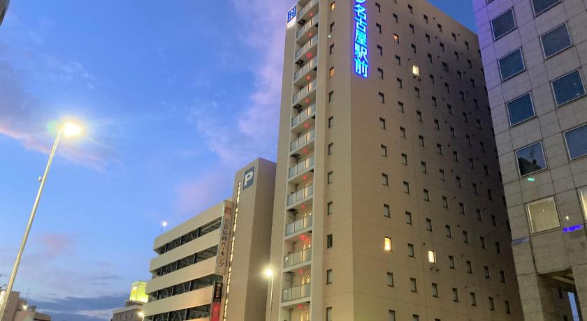 a tall building with a clock on the top of it, Meitetsu Inn Nagoyaekimae in Nagoya