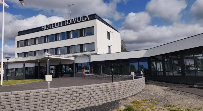 a large building with a clock on the side of it, HOSTEL TOIVOLA in Kemi
