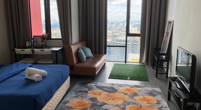 a living room with a couch, chair and a table, Empihaus 002 Empire Damansara in Kuala Lumpur