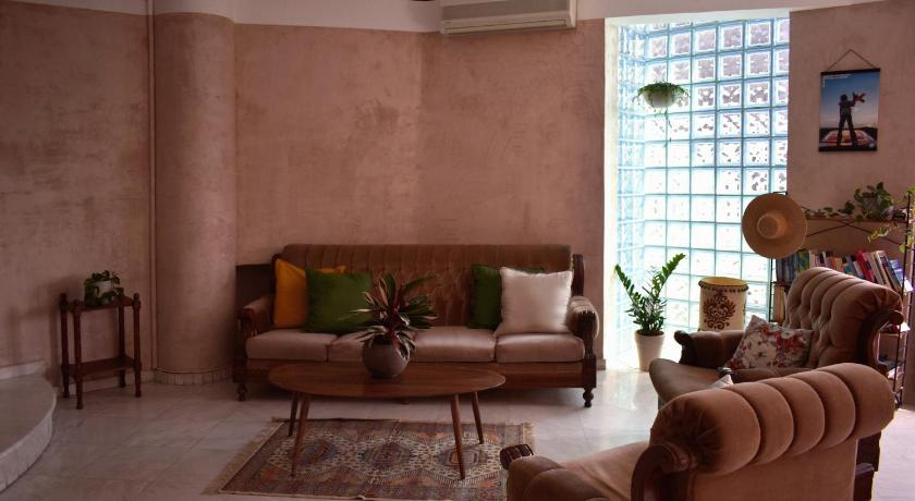 a living room filled with furniture and a large window, Crossroads in Thessaloniki