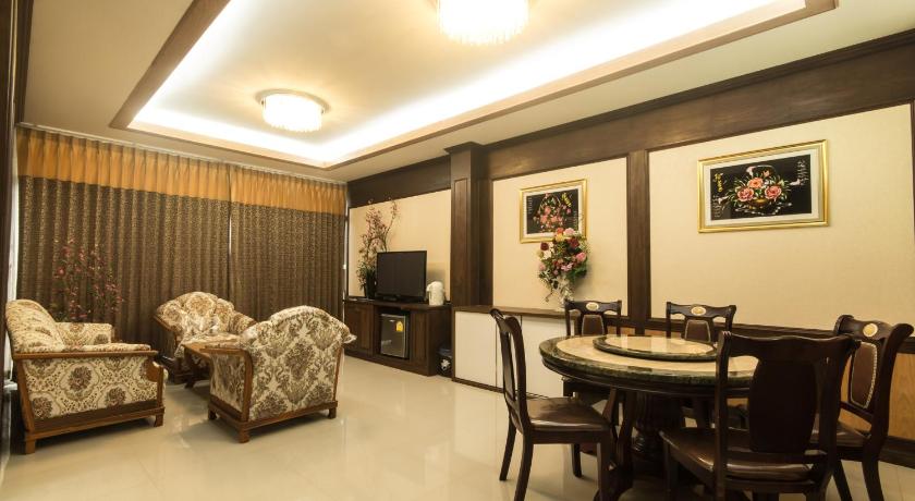 a living room filled with furniture and a large window, The Muk Lagoon hotel (SHA Extra Plus) in Mukdahan