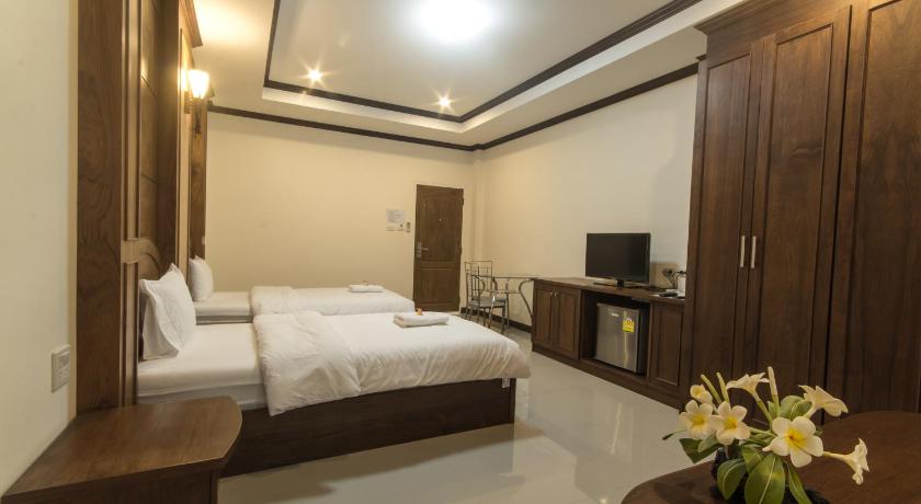 a hotel room with a large bed and a large window, The Muk Lagoon hotel (SHA Extra Plus) in Mukdahan