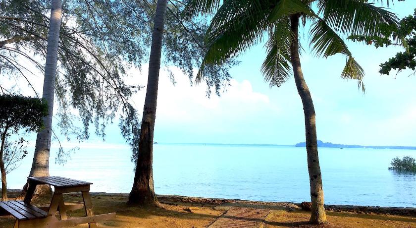 a beach with palm trees and palm trees, Port Dickson @12Haven StunningSeaside LuxuryVilla  in Port Dickson