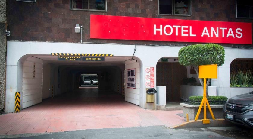 a building with a sign on the side of it, Hotel Antas in Mexico City
