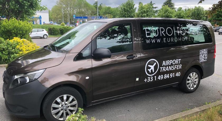 a white van parked on the side of a road, Eurohotel Airport Orly Rungis in Paris