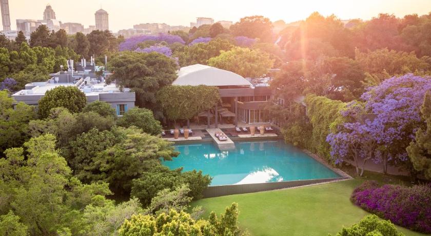 a green lawn with a view of the ocean, Saxon Hotel Villas and Spa in Johannesburg
