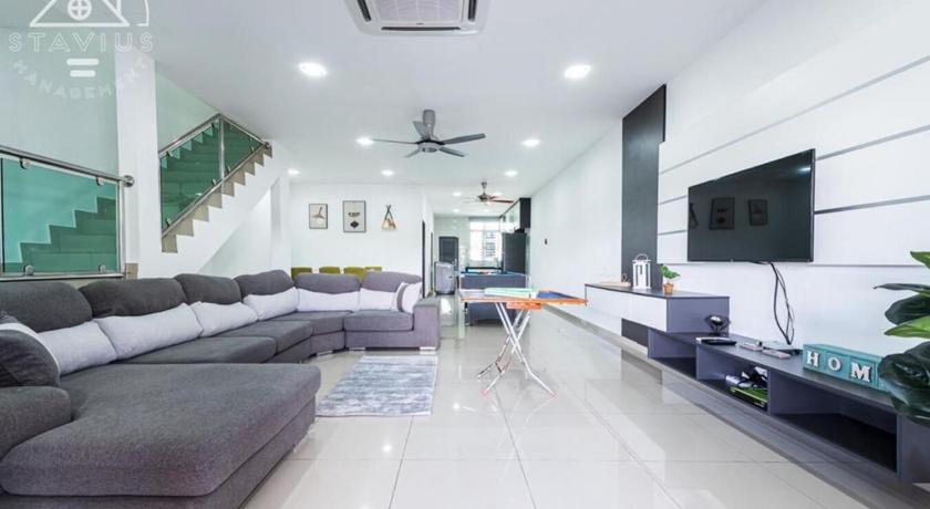 a living room filled with furniture and a tv, Happy Villa Homestay in Port Dickson