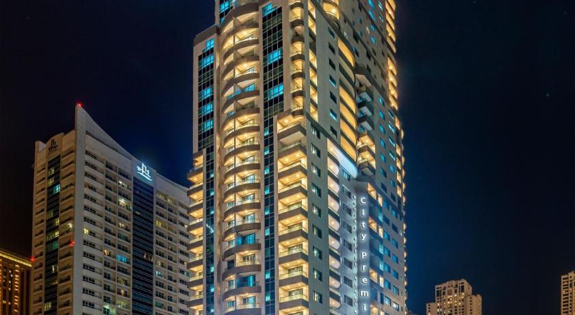 a city street at night with tall buildings, City Premiere Marina Hotel Apartments in Dubai