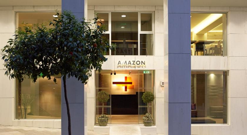 a building with a tree in front of it, Amazon Hotel in Athens