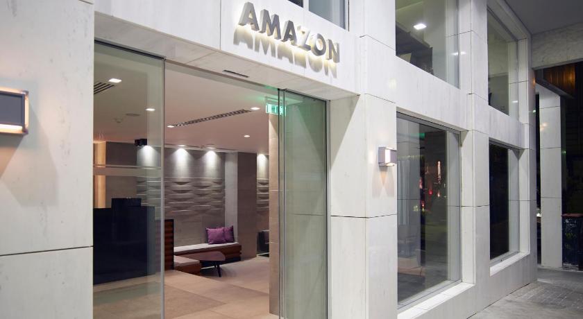 a large building with a sign on the side of it, Amazon Hotel in Athens