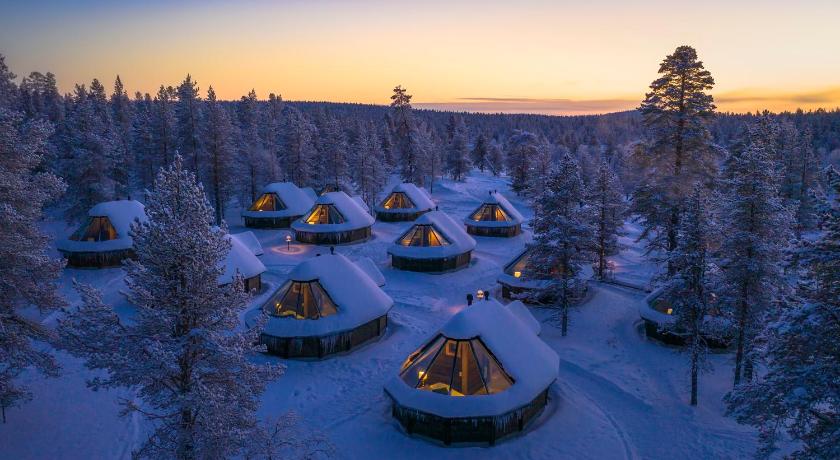 a lake filled with lots of skis and boats, Wilderness Hotel & Igloos Muotka in Sodankyla