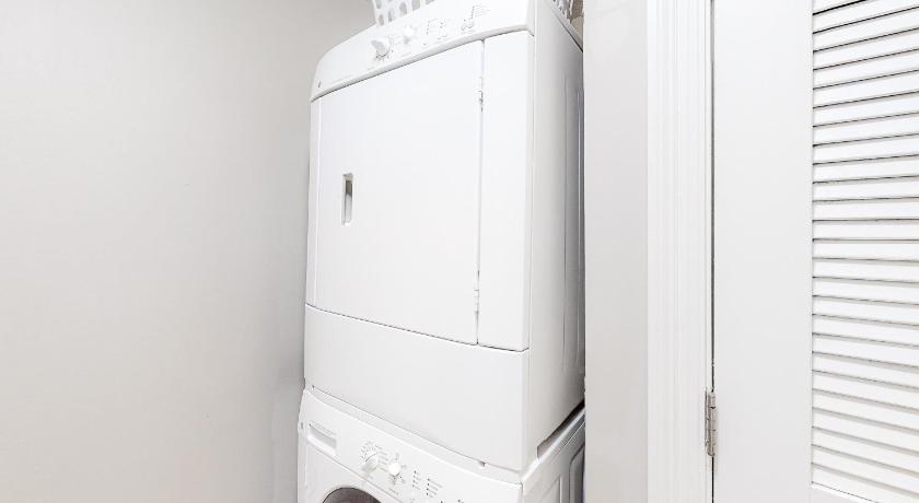 a white refrigerator freezer sitting in a kitchen, Ariel Dunes II in Destin (FL)
