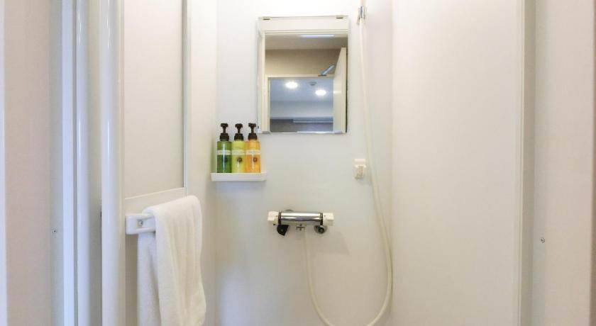 a bathroom with a shower, toilet, and sink, THE LIGHT INN TOKYO TONERI in Tokyo