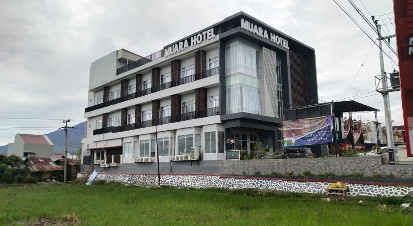 a large building with a sign on the side of it, Muara Hotel in Bukittinggi