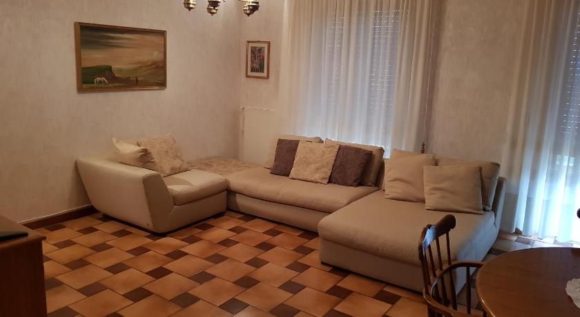 a living room with a couch and a table, Casa Vacanze Nonna Gio in Tuscania