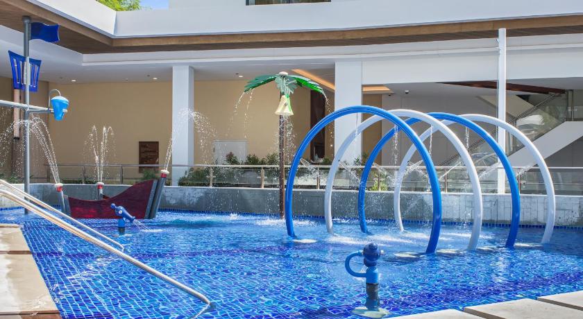 a swimming pool with a blue and white tub, Best Western Plus The Ivywall Resort-Panglao in Bohol
