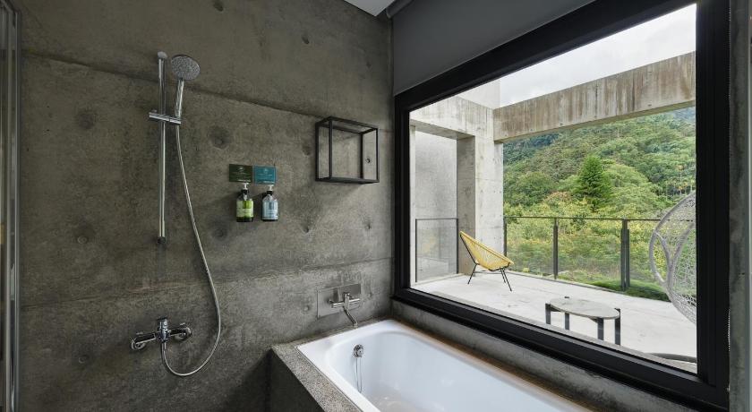 a bathroom with a tub and a window, Meet Sun Moon Lake in Nantou