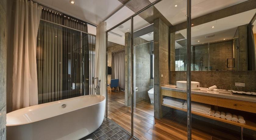 a bathroom with a large tub and a large window, Meet Sun Moon Lake in Nantou
