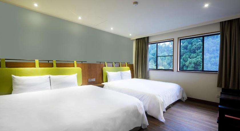a hotel room with two beds and two lamps, Howard Resort Xitou Hotel in Nantou