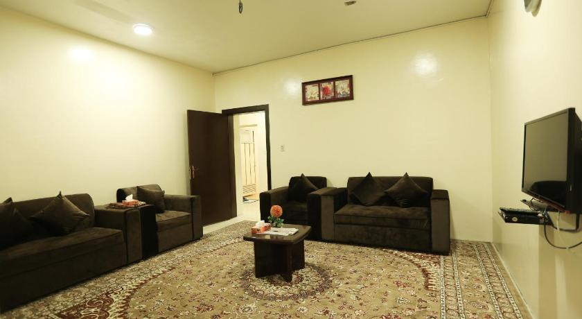 a living room filled with furniture and a tv, العييري للوحات المفروشة الدمام 7 in Dammam