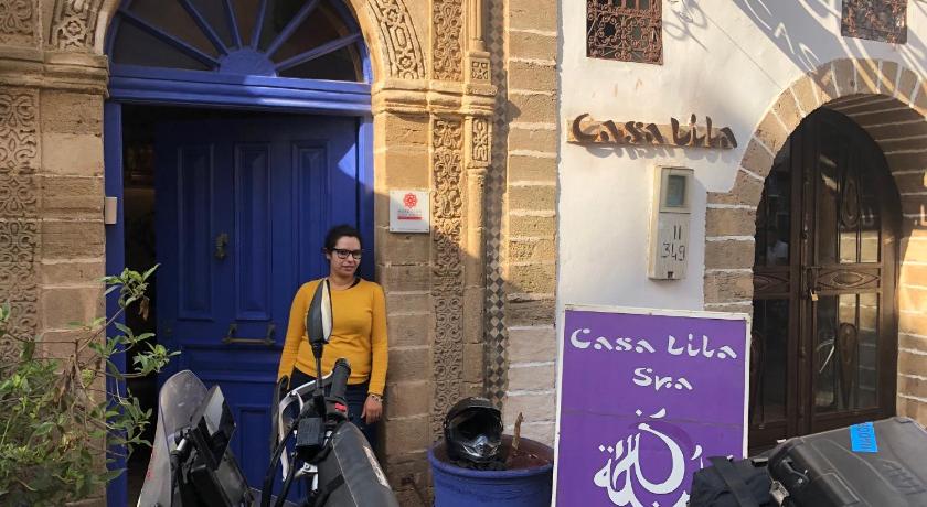 a woman sitting on a motorcycle outside of a building, Casa Lila & Spa in Essaouira