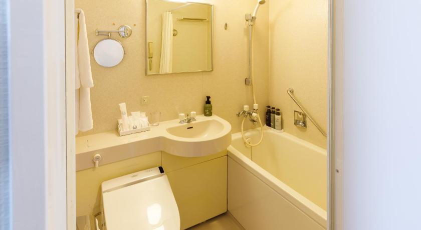 a bathroom with a toilet, sink, and bathtub, Chisun Grand Takayama in Takayama