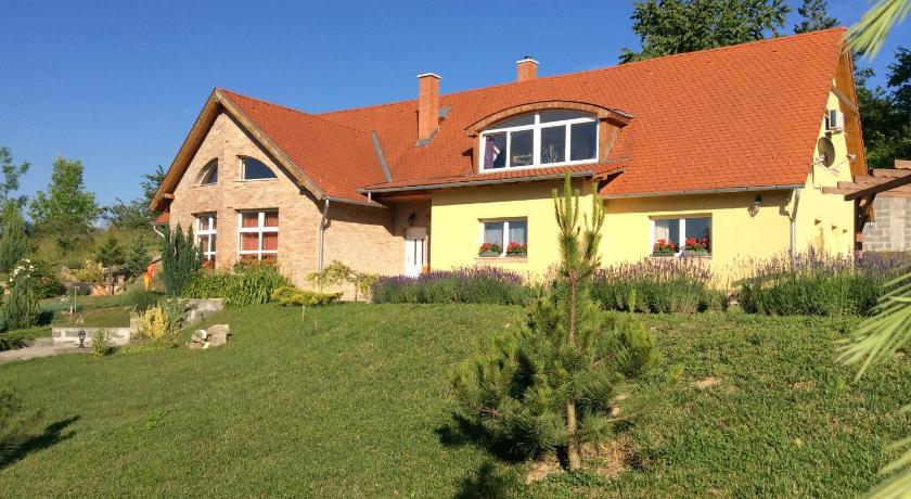 a small house with a tree in the back yard, Apartments for Rent near Budapest in Etyek