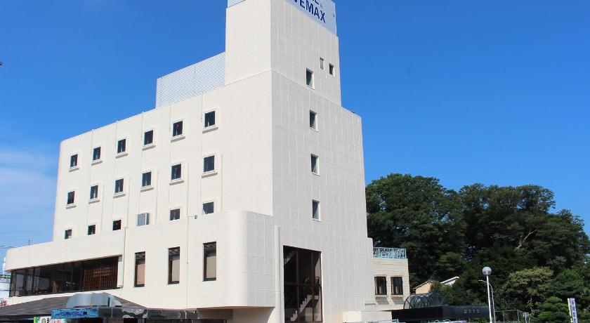 a large white building with a clock on top, Hotel Livemax BUDGET Utsunomiya in Utsunomiya