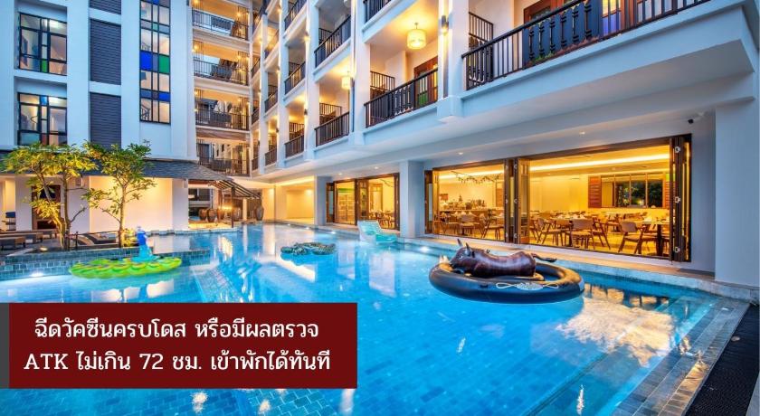 a hotel room with a large swimming pool, Monkham Village Hat Yai (SHA Extra Plus) in Hat Yai