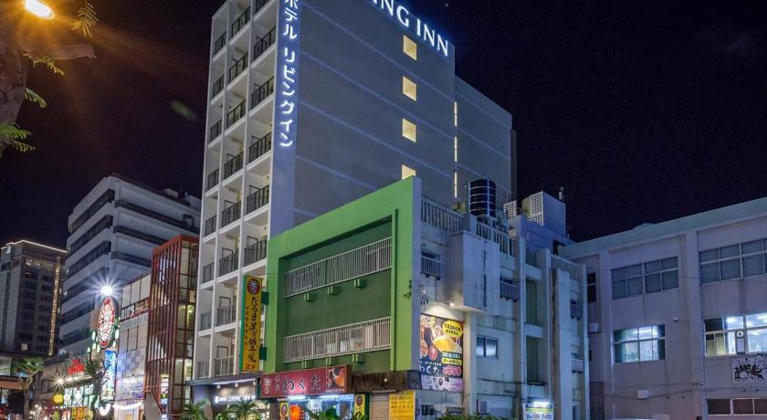 a large building with a clock on the side of it, Condominium Resort Naha Living Inn Asahibashiekimae Premier and Annex in Okinawa Main island