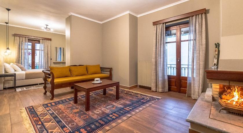 a living room filled with furniture and a fireplace, Ef Zin Hotel Arachova in Arachova