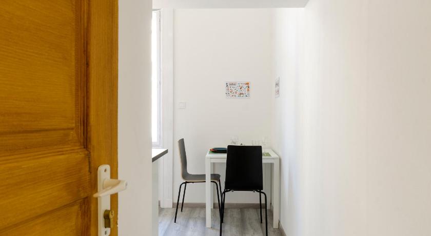 a small room with a door leading to a hallway, Bartok Suites in Budapest