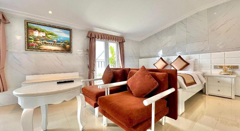 a living room with a large bed and a large window, Tulip Hotel 3 in Dalat
