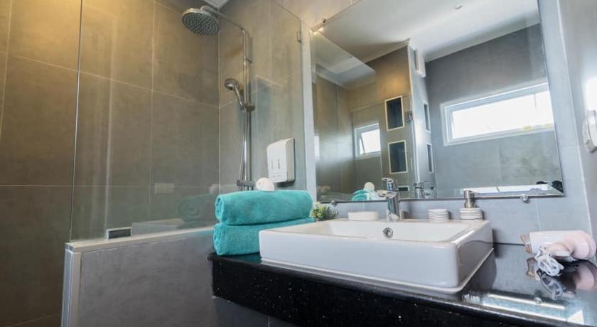 a bathroom with a sink, tub, and shower, Surf & Sand Resort (SHA Extra Plus) in Hua Hin / Cha-am