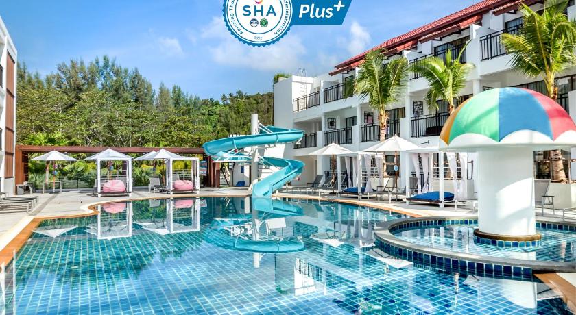 a swimming pool with a swimming pool table and chairs, Destination Resort Phuket Karon Beach (SHA Plus+) in Phuket