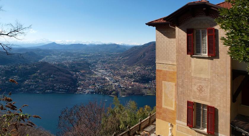 a large building with a view of the ocean, B&B Il Balcone sul Lago in Brunate