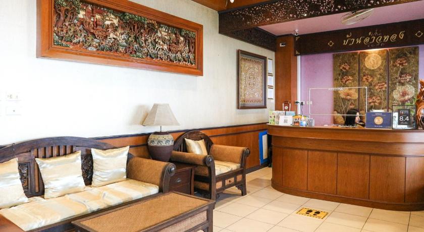a living room with two couches and a coffee table, Ban Aothong Hotel in Trang