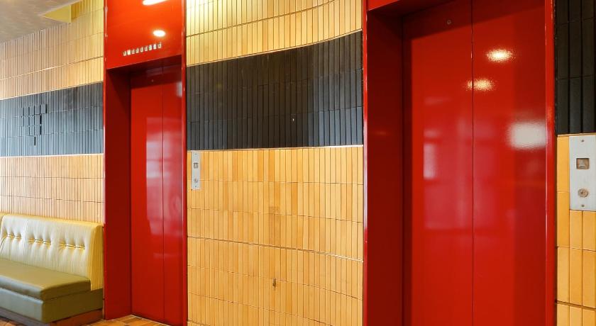 a red and white urinal in a public restroom, Hotel Abest Osu Kannon Ekimae in Nagoya