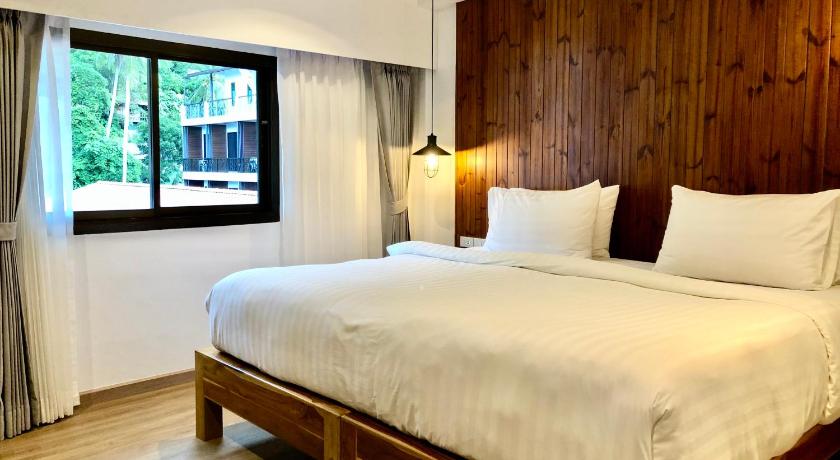 a bedroom with a large bed and a large window, P2 Wood Loft in Ko Phi Phi