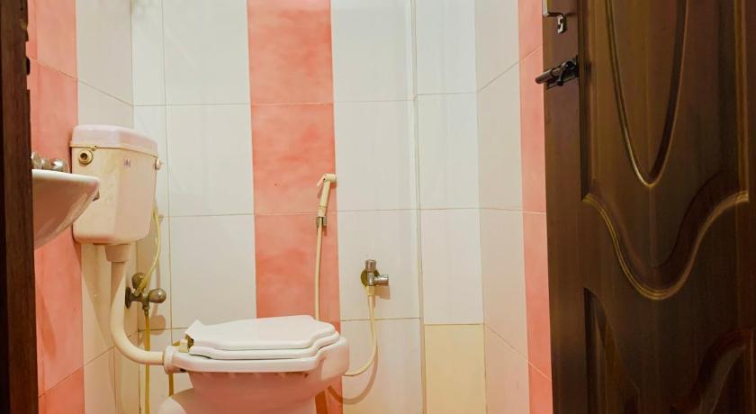 a bathroom with a toilet and a sink, Swarajdeep Vacations in Andaman and Nicobar Islands