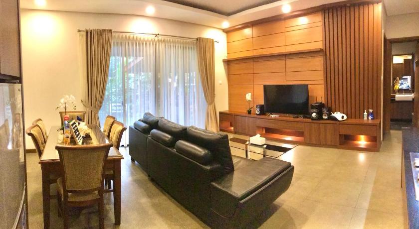 a living room filled with furniture and a tv, Vimala Hills Villa 3 Bedrooms in Puncak
