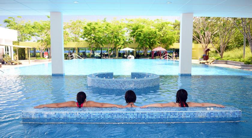 two people in a pool with a blue and white tub, The Orchard Wellness & Health Resort in Malacca