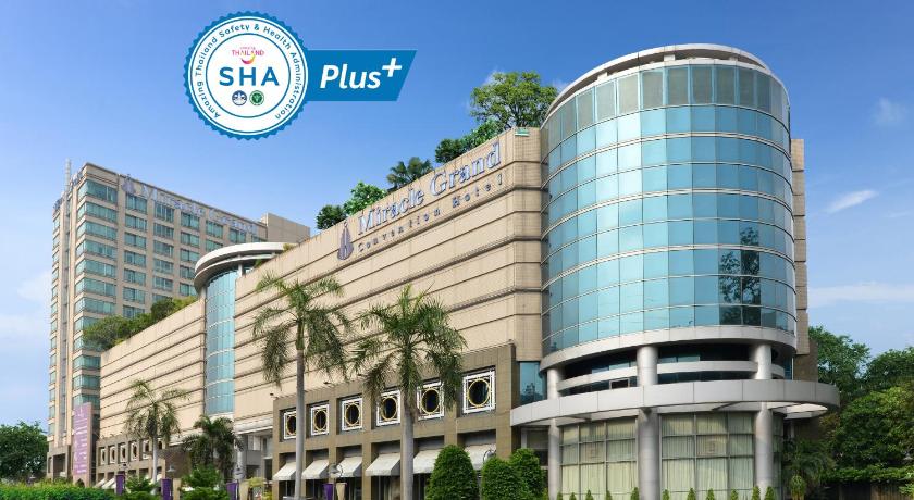 a large building with a clock on the side of it, Miracle Grand Convention Hotel (SHA Extra Plus) in Bangkok