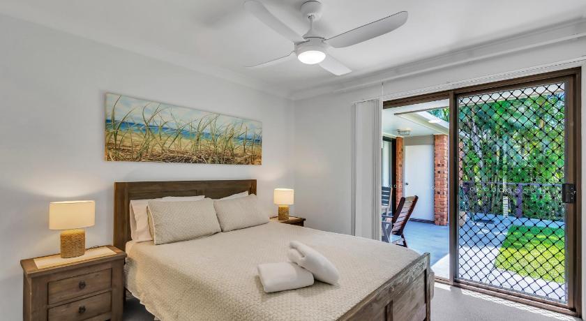 a bedroom with a large bed and a large window, Sea-Ann - Lennox Head - WiFi in Lennox Head
