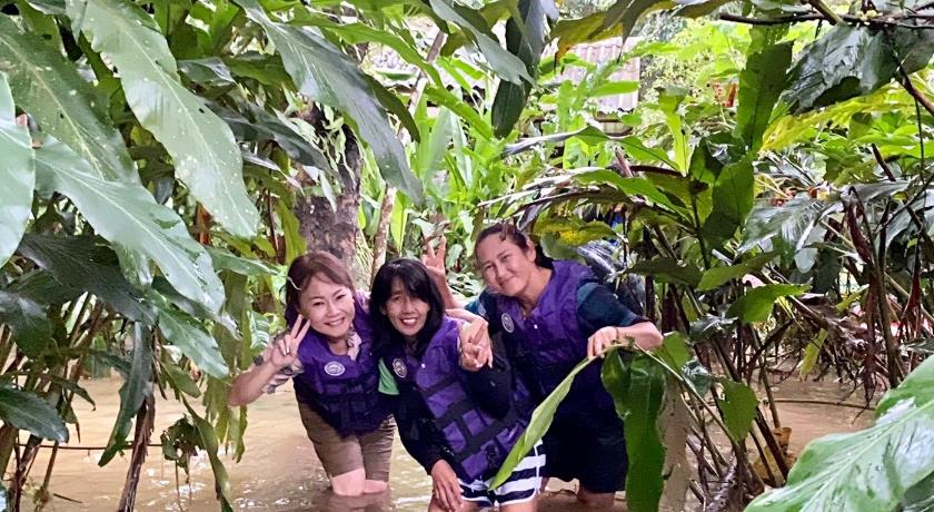 two women standing next to each other in a jungle, Khao Sok River Lodge Hotel (SHA Extra Plus) in Surat Thani