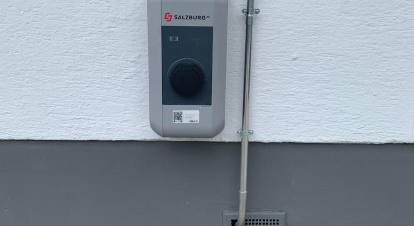 a cell phone is attached to a wall, Glemm Lodge Apartments in Saalbach