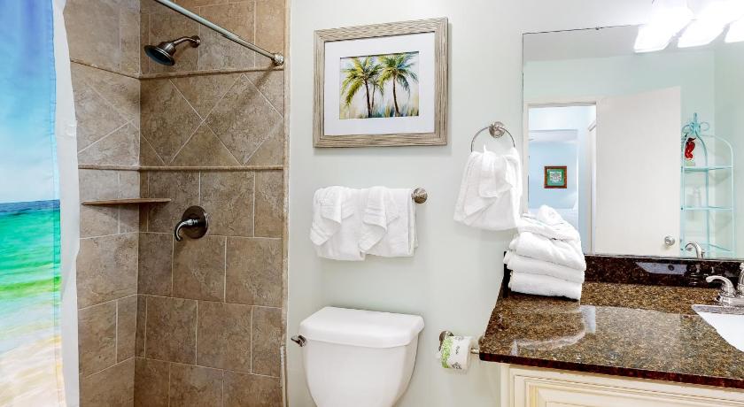 a bathroom with a toilet, sink and shower, Sea Oats II in Gulf Shores (AL)